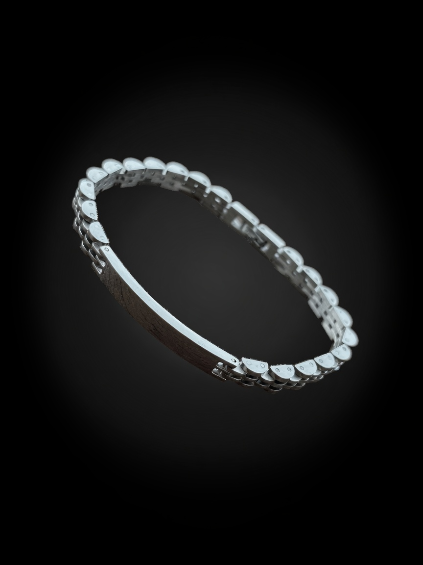 Pulsera AYNI de acero con placa y eslabones articulados